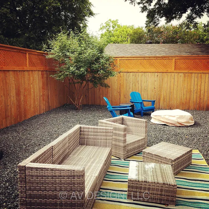 Cedar privacy fence with lattice top enclosing a gravel backyard patio