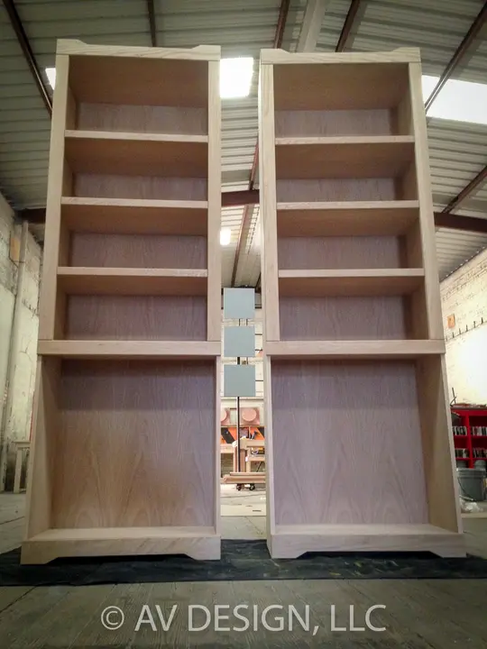 Pair of tall oak bookcases with shaped base molding, built before finishing