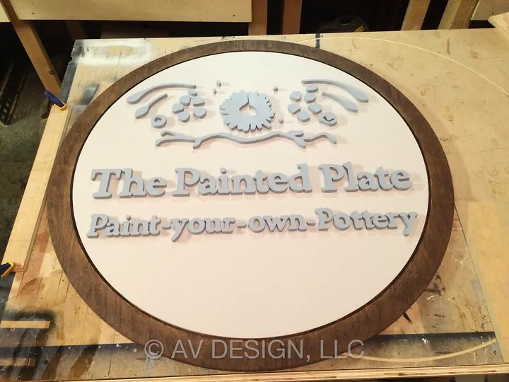 Large routed wood sign with raised lettering for The Painted Plate pottery studio