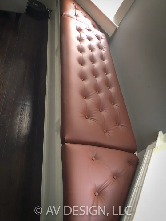 Tufted leather upholstered panel on a built-in seat