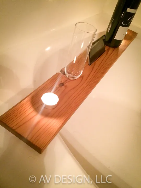Stained wood tray with a cut-out for a wine glass and a candle